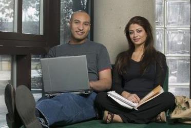 Young adult couple in library
